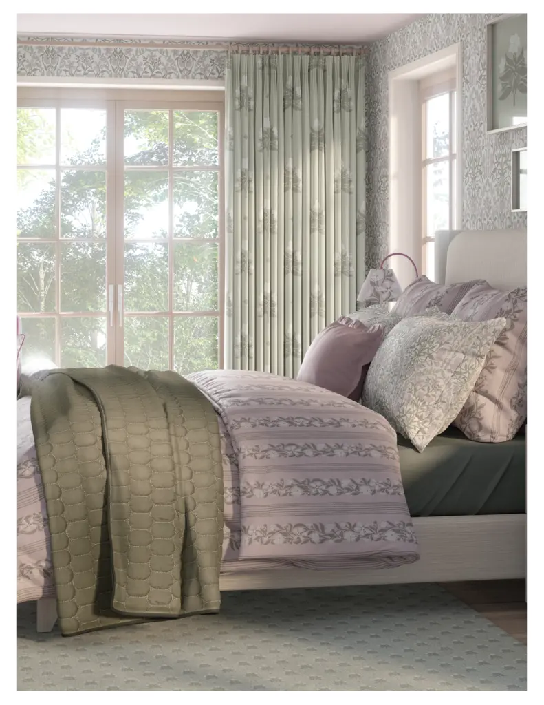 A cozy bedroom featuring floral-patterned bedding and soft green accents, with natural light streaming through large windows and patterned curtains.