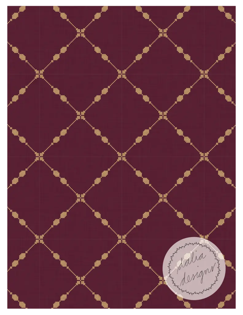 Burgundy red patterned fabric featuring a geometric design with diamonds and decorative motifs in gold.